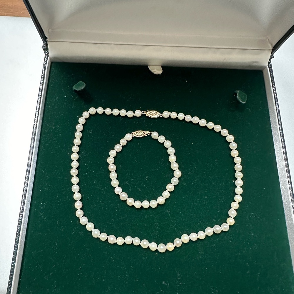 Genuine pearls, with 14 karat gold clasps, 14” necklace, 6” bracelet, Earrings